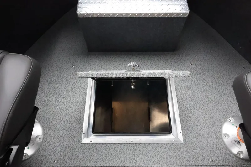 Slide: The Image of 2026 Thunder Jet 210 Luxor Limited boat interior with open storage compartment. - 30