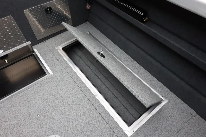 Slide: The Image of 2026 Thunder Jet 210 Luxor Limited boat interior storage compartments, featuring durable metal finishes. - 38