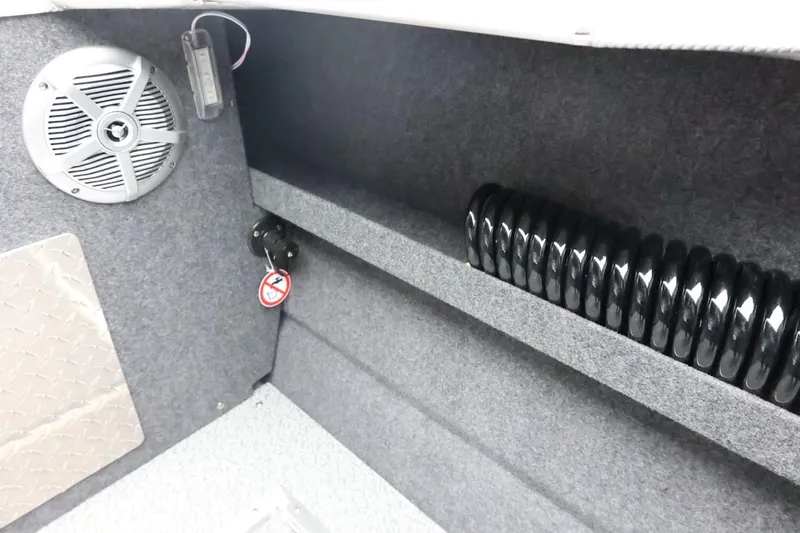 Slide: The Image of Interior of 2026 Thunder Jet 210 Luxor Limited boat with speaker and coiled cable. - 39