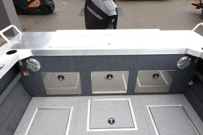 Slide: The Image of 2026 Thunder Jet 210 Luxor Limited boat interior with storage compartments and Mercury engine. - 41