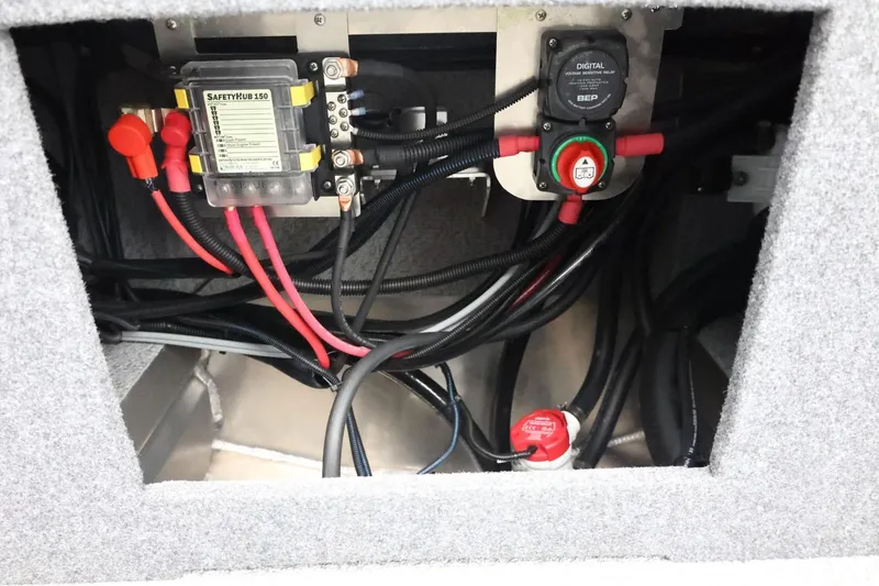 Slide: The Image of Electrical components inside 2026 Thunder Jet 210 Luxor Limited boat, featuring wiring and safety hub. - 43