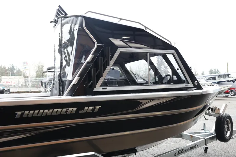 Slide: The Image of 2026 Thunder Jet 210 Luxor Limited boat on trailer, side view. - 5