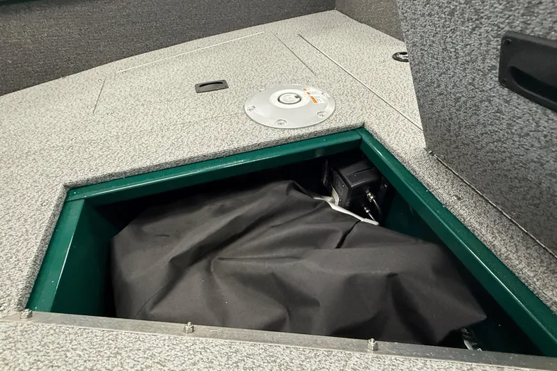 Slide: The Image of Storage compartment in 2026 Lund Angler 1650 SS boat interior. - 15
