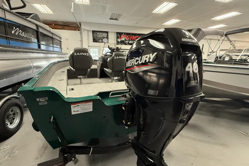 Slide: The Image of 2026 Lund Angler 1650 SS boat with Mercury 40 HP outboard motor in showroom. - 18