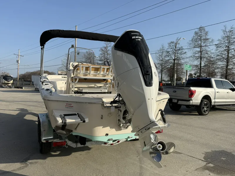 Slide: The Image of 2026 Sea Chaser 23 LX boat with outboard motor on trailer. - 6