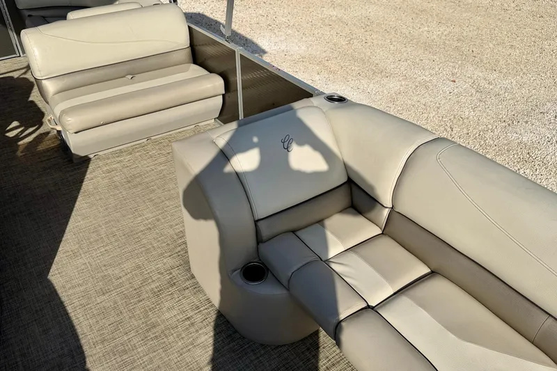 Slide: The Image of 2022 Cypress Cay Seabreeze 232 boat helm with steering wheel and controls. - 14