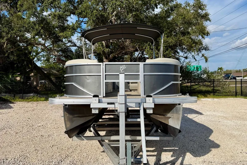 Slide: The Image of 2022 Cypress Cay Seabreeze 232 pontoon boat on trailer, sunny day, outdoor display. - 2