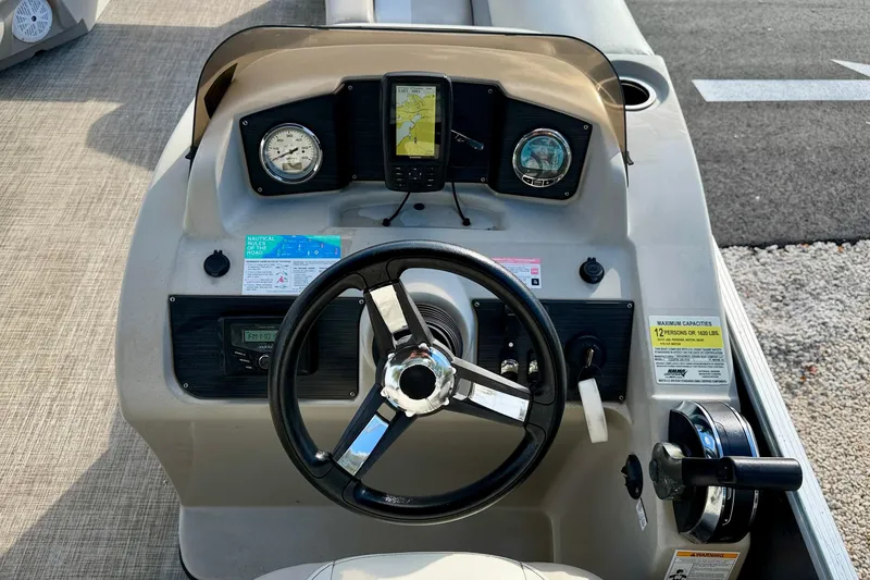 Slide: The Image of Luxurious seating on 2022 Cypress Cay Seabreeze 232 pontoon boat, featuring beige upholstery. - 20