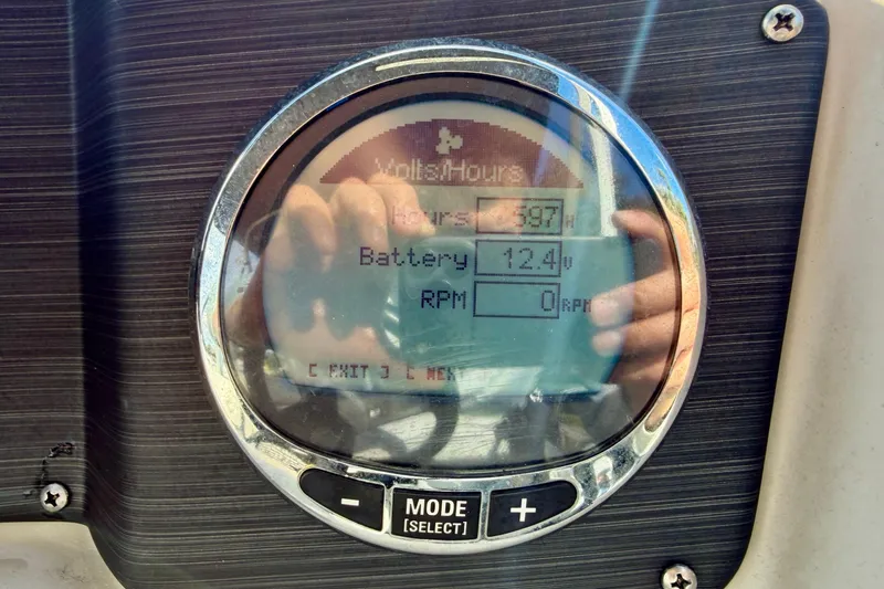 Slide: The Image of Battery compartment of 2022 Cypress Cay Seabreeze 232 pontoon boat, showing wiring and connections. - 23