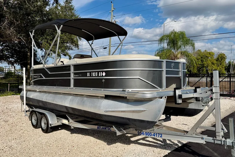 Slide: The Image of 2022 Cypress Cay Seabreeze 232 pontoon boat on trailer, parked outdoors. - 3