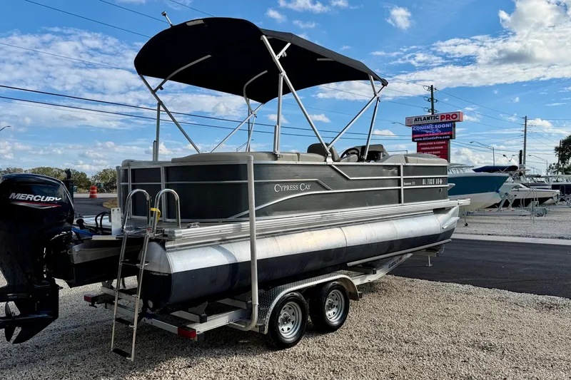 Slide: The Image of 2022 Cypress Cay Seabreeze 232 pontoon boat on trailer with Mercury outboard engine. - 5