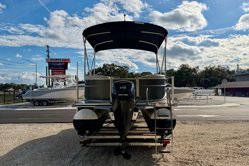 Slide: The Image of 2022 Cypress Cay Seabreeze 232 pontoon boat with Mercury 115 engine, parked outdoors. - 6