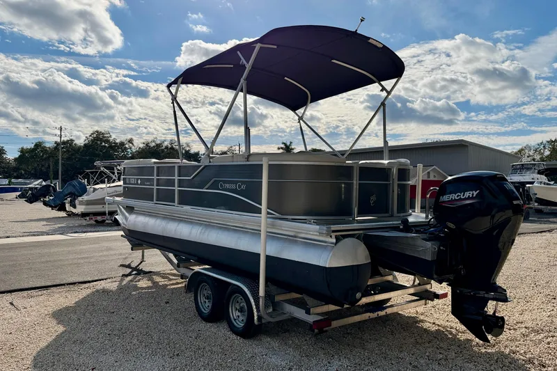 Slide: The Image of 2022 Cypress Cay Seabreeze 232 pontoon boat on trailer with Mercury outboard motor. - 7