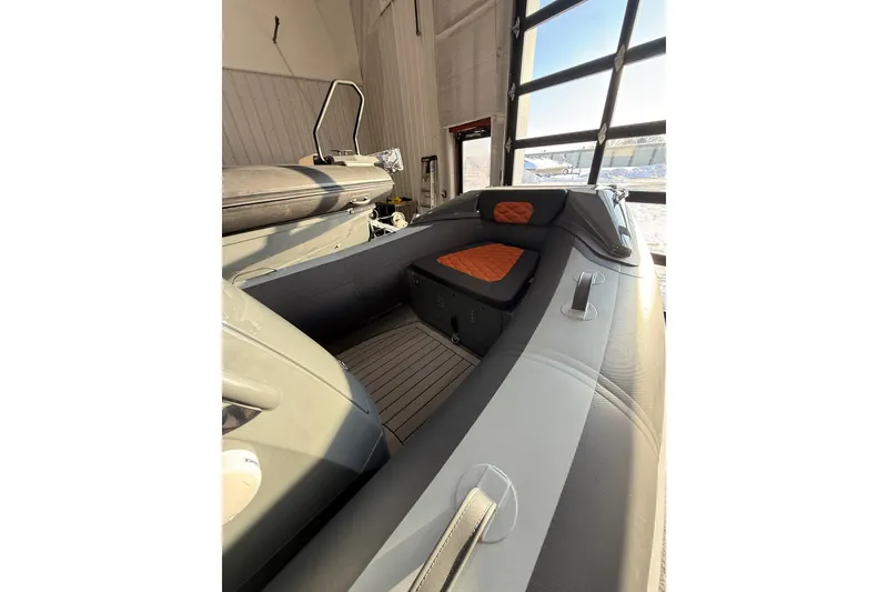 Slide: The Image of 2026 Highfield Sport 360 boat interior with cushioned seating and modern design. - 7