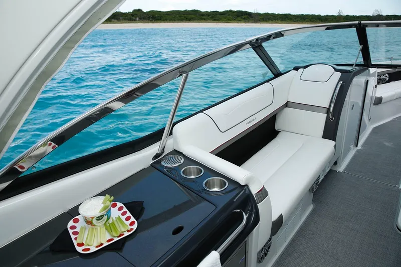 Slide: The Image of Manufacturer Provided Image: 2023 Formula 350 Crossover Bowrider I/O interior with white seating and ocean view. - 8