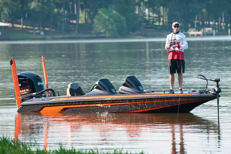Slide: The Image of Manufacturer Provided Image: 2016 Skeeter FX 20 Limited Edition bass boat on a calm lake with an angler fishing. - 10