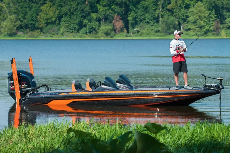 Slide: The Image of Manufacturer Provided Image: 2016 Skeeter FX 20 Limited Edition bass boat on a lake with an angler fishing. - 9