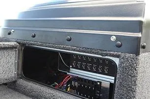 Slide: The Image of Livewell compartment in 2026 Lund 1875 Pro-V boat with net and cup holders. - 12