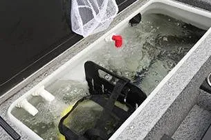 Slide: The Image of 2026 Lund 1875 Pro-V boat interior with gray carpet and swivel seat. - 15