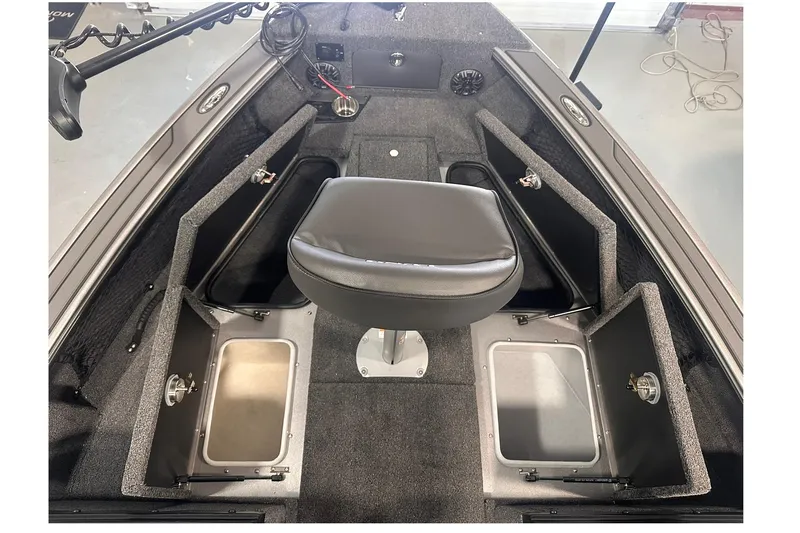 Slide: The Image of 2026 Lund 1875 Pro-V boat interior with storage compartments and swivel seat. - 16
