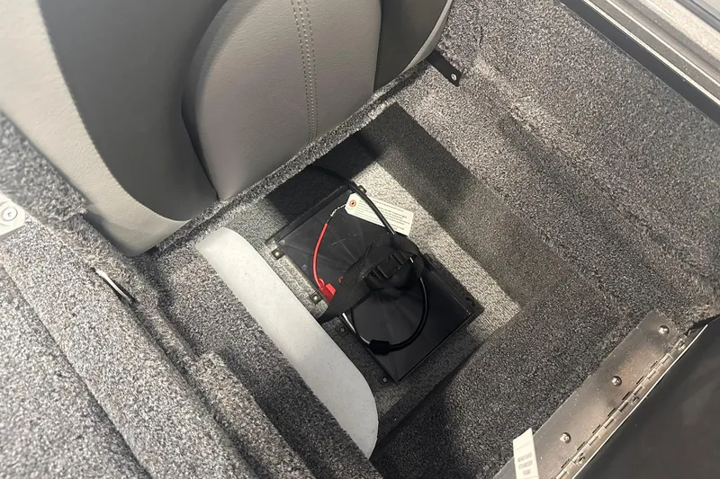 Slide: The Image of 2026 Lund 1875 Pro-V boat interior with battery compartment under seat. - 33