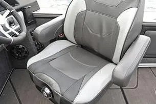 Slide: The Image of 2026 Lund 1875 Pro-V boat interior with steering wheel, dashboard, and storage compartments. - 9