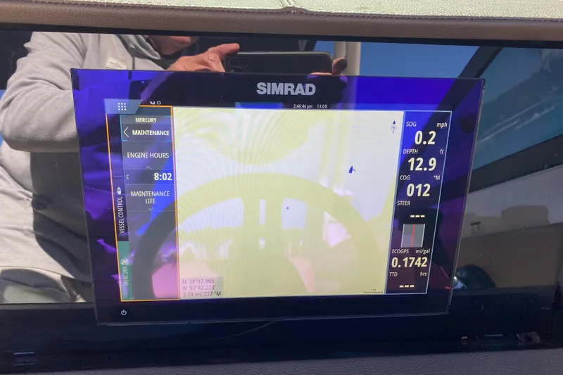 Slide: The Image of Simrad display on 2022 Sea Ray SDX 270 Outboard showing navigation and engine data. - 21