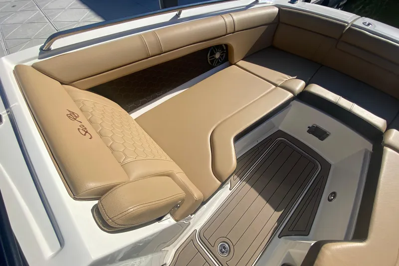 Slide: The Image of 2022 Sea Ray SDX 270 Outboard boat interior with tan leather seating. - 25