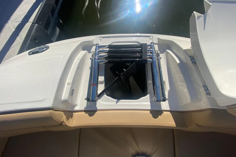 Slide: The Image of 2022 Sea Ray SDX 270 Outboard boat with open storage compartment and ladder. - 27