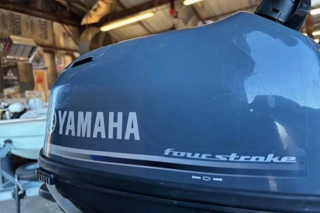 Slide: The Image of 2024 Tracker Grizzly 1436 Jon boat on trailer, parked outdoors. - 7