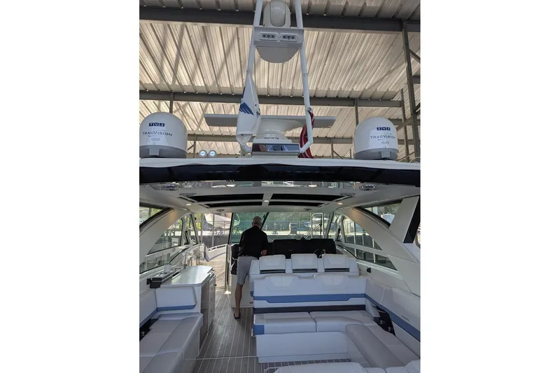 Slide: The Image of 2024 Formula 430 Super Sport Crossover luxury yacht interior with seating and advanced navigation equipment. - 19