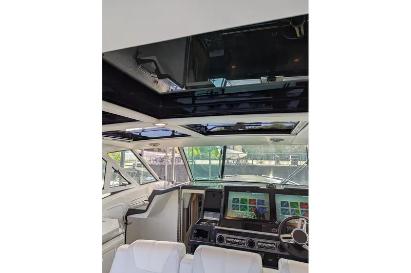 Slide: The Image of 2024 Formula 430 Super Sport Crossover cockpit with advanced navigation displays and luxurious seating. - 20