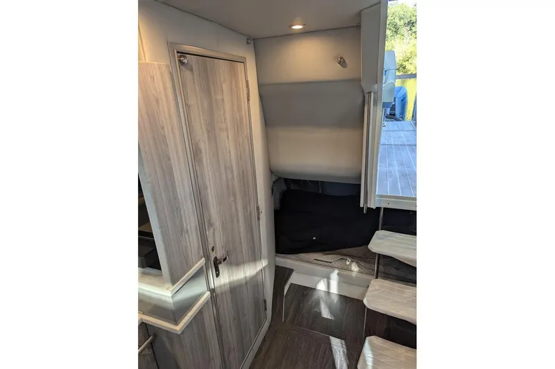 Slide: The Image of Interior of 2024 Formula 430 Super Sport Crossover, featuring modern wood paneling and sleek design. - 23