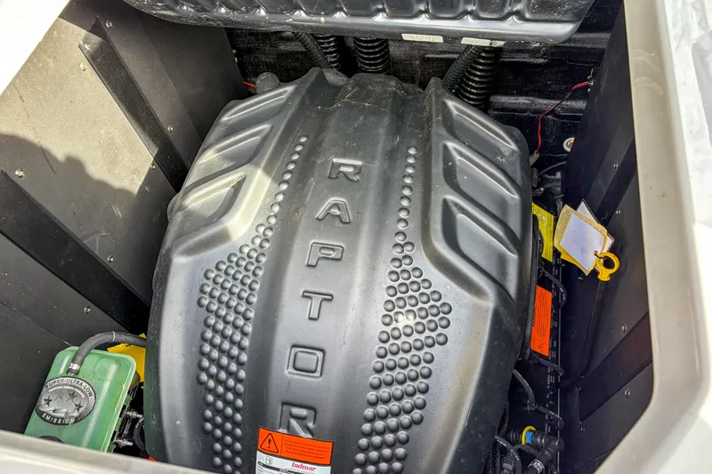 Slide: The Image of 2024 Moomba Max engine compartment featuring a Raptor engine cover. - 13