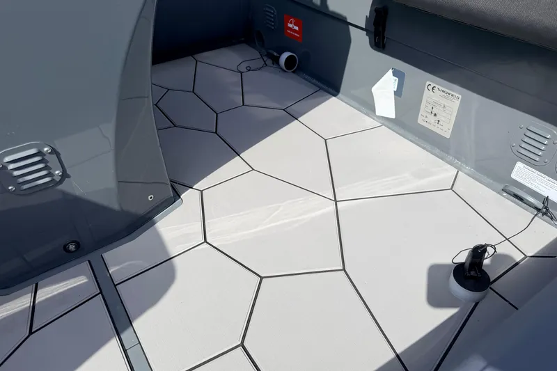 Slide: The Image of 2026 Highfield Sport 520 boat interior with geometric flooring design. - 10