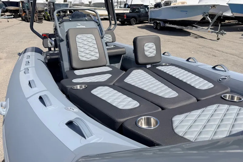 Slide: The Image of 2026 Highfield Sport 520 boat interior with quilted seating and cup holders. - 15