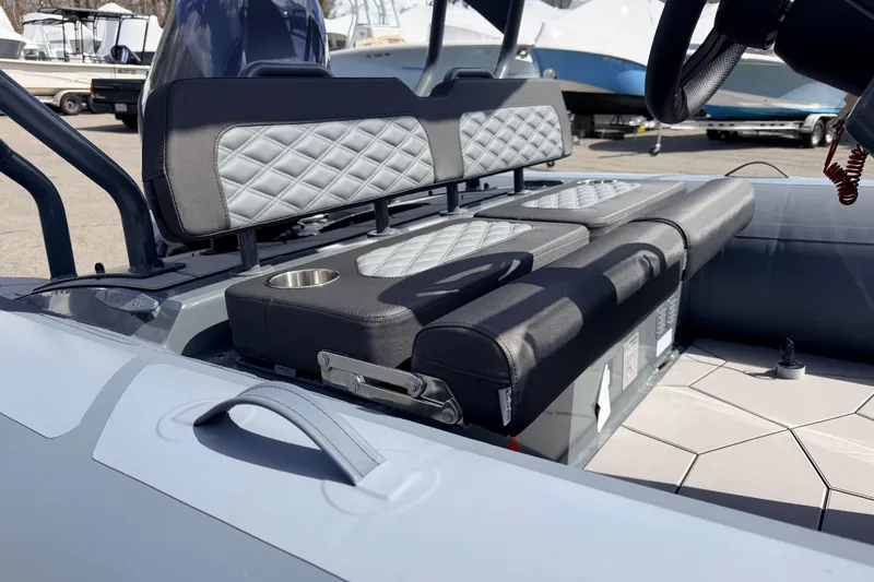 Slide: The Image of 2026 Highfield Sport 520 boat interior with quilted seating and cup holder. - 16