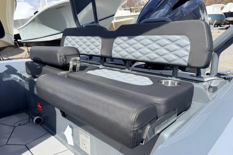Slide: The Image of Highfield Sport 520 boat interior, featuring cushioned seating with diamond stitching, 2026 model. - 17