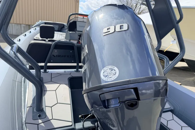 Slide: The Image of Highfield Sport 520 boat with Yamaha 90 engine, 2026 model, featuring sleek design and modern seating. - 6