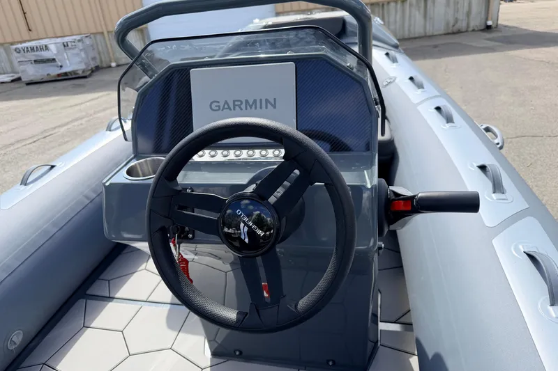 Slide: The Image of 2026 Highfield Sport 520 boat dashboard with Garmin navigation system. - 8