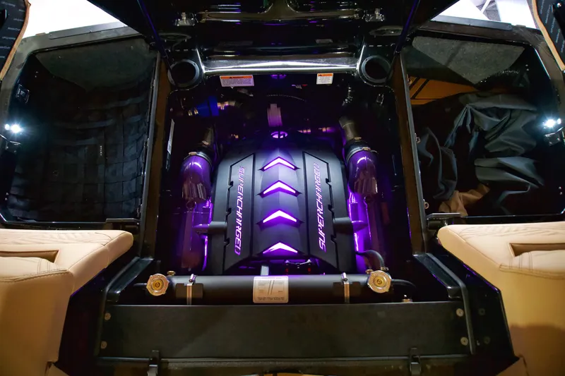Slide: The Image of 2025 MasterCraft XStar 23 engine with purple lighting, showcasing supercharged power. - 14