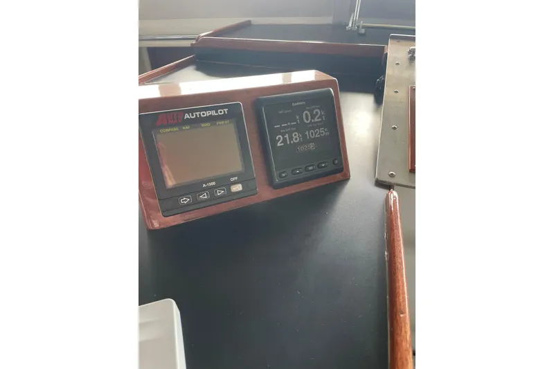 Slide: The Image of Autopilot and navigation display on 1967 Huckins Offshore boat dashboard. - 15