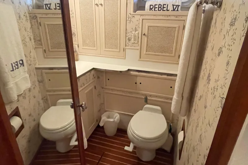 Slide: The Image of Bathroom interior of 1967 Huckins Offshore yacht with floral wallpaper and wooden flooring. - 39