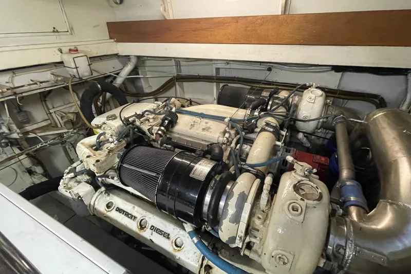 Slide: The Image of Engine room of a 1967 Huckins Offshore boat, featuring a Detroit Diesel engine. - 43