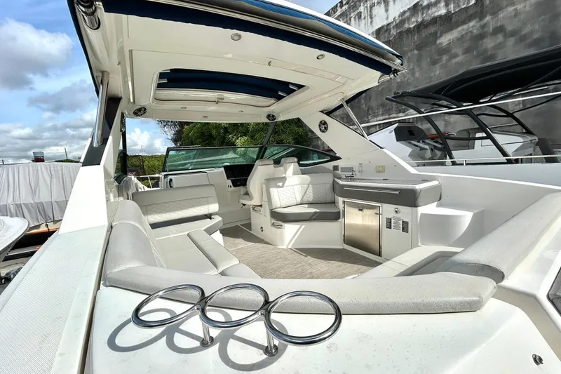 Slide: The Image of 2020 Sea Ray Sundancer 320 interior with luxurious seating and modern amenities. - 3