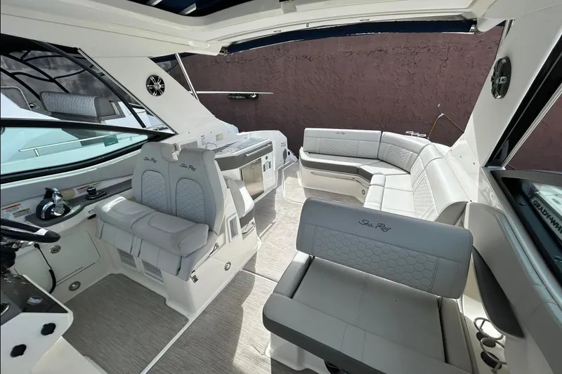 Slide: The Image of 2020 Sea Ray Sundancer 320 interior with luxurious seating and modern design. - 4