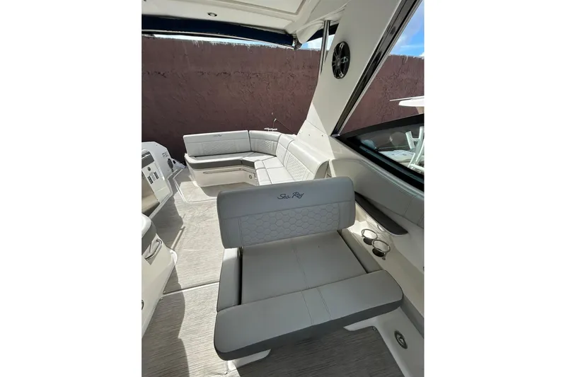 Slide: The Image of 2020 Sea Ray Sundancer 320 interior with luxurious seating and modern design. - 9