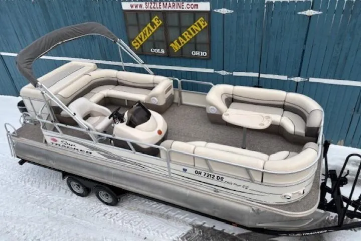 The Image of 2004 Sun Tracker Party Barge 22 Regency Edition pontoon boat on trailer in snowy setting. - 0