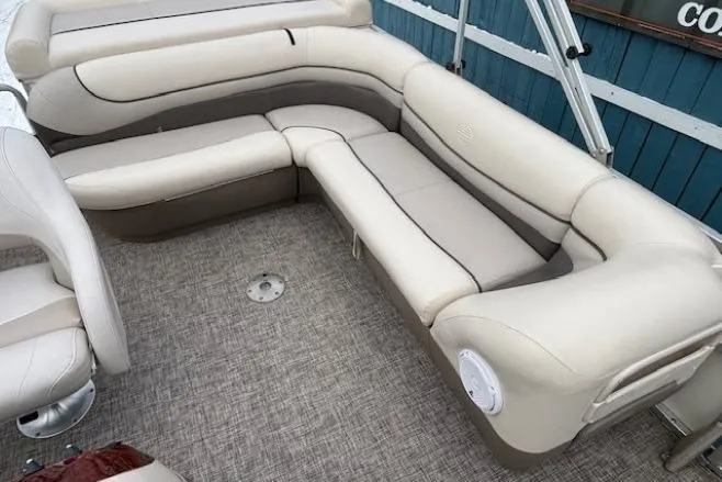 Slide: The Image of 2004 Sun Tracker Party Barge 22 Regency Edition with beige seating and spacious deck. - 19