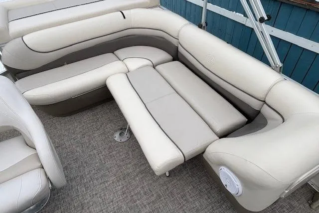Slide: The Image of 2004 Sun Tracker Party Barge 22 Regency Edition with beige seating and carpeted floor. - 20